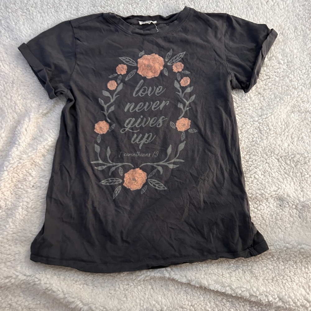 Grey “Love Never Fails” Tee